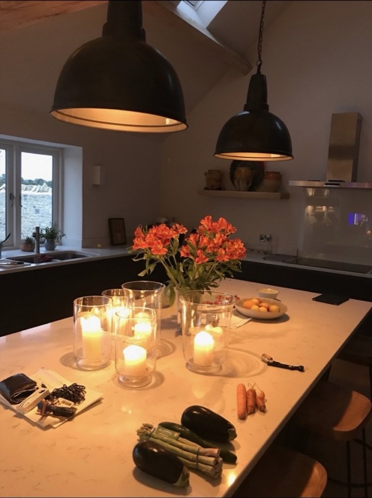Warmly lit holiday accommodation kitchen interior