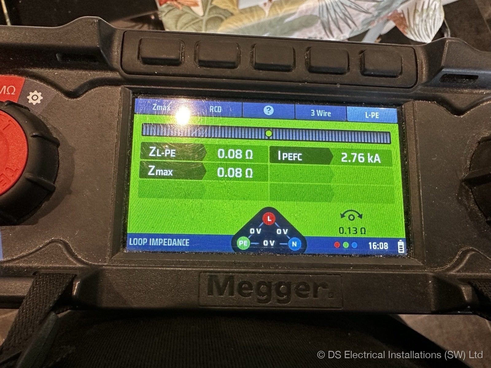 Electrician carrying out EICR testing with a multifunction tester