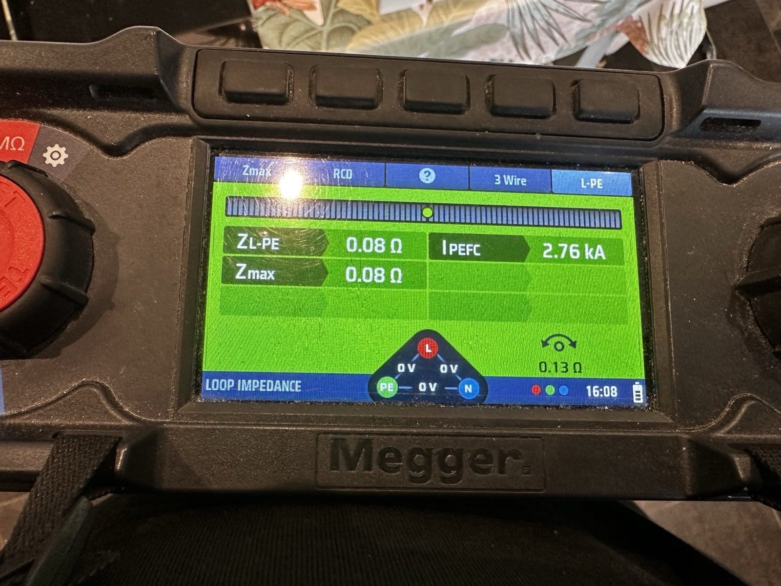 Electrician carrying out EICR testing with a multifunction tester