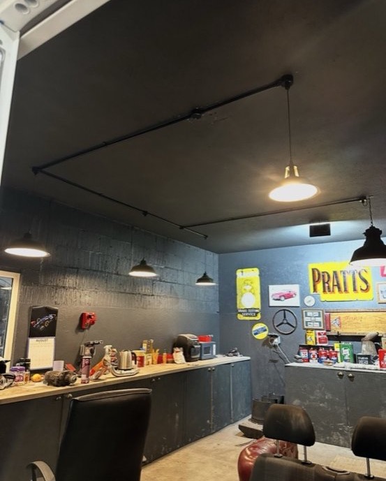 Commercial barber shop with industrial track lighting