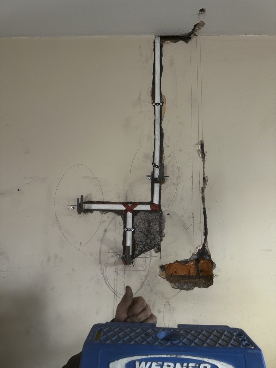 Walls chased for new cabling during flat rewire