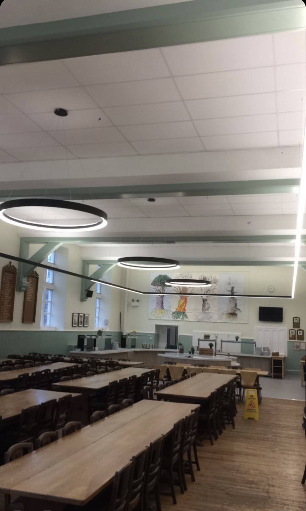 Heritage church nave lit with concealed warm-white LED uplighters along stone columns