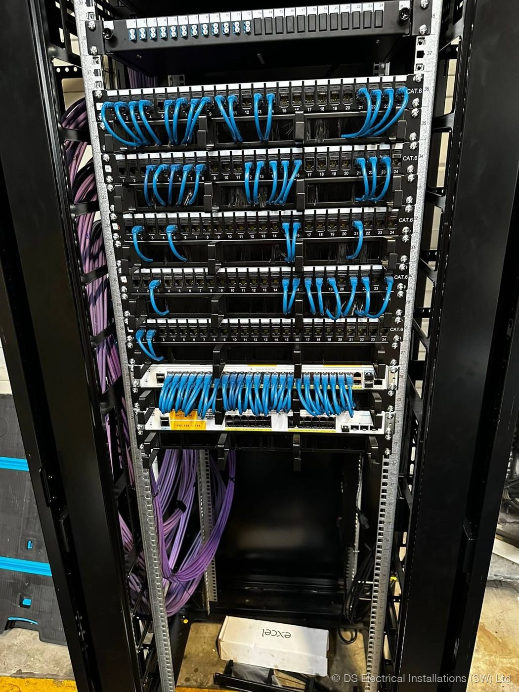 Structured network cabinet with patched data cabling by DS Electrical