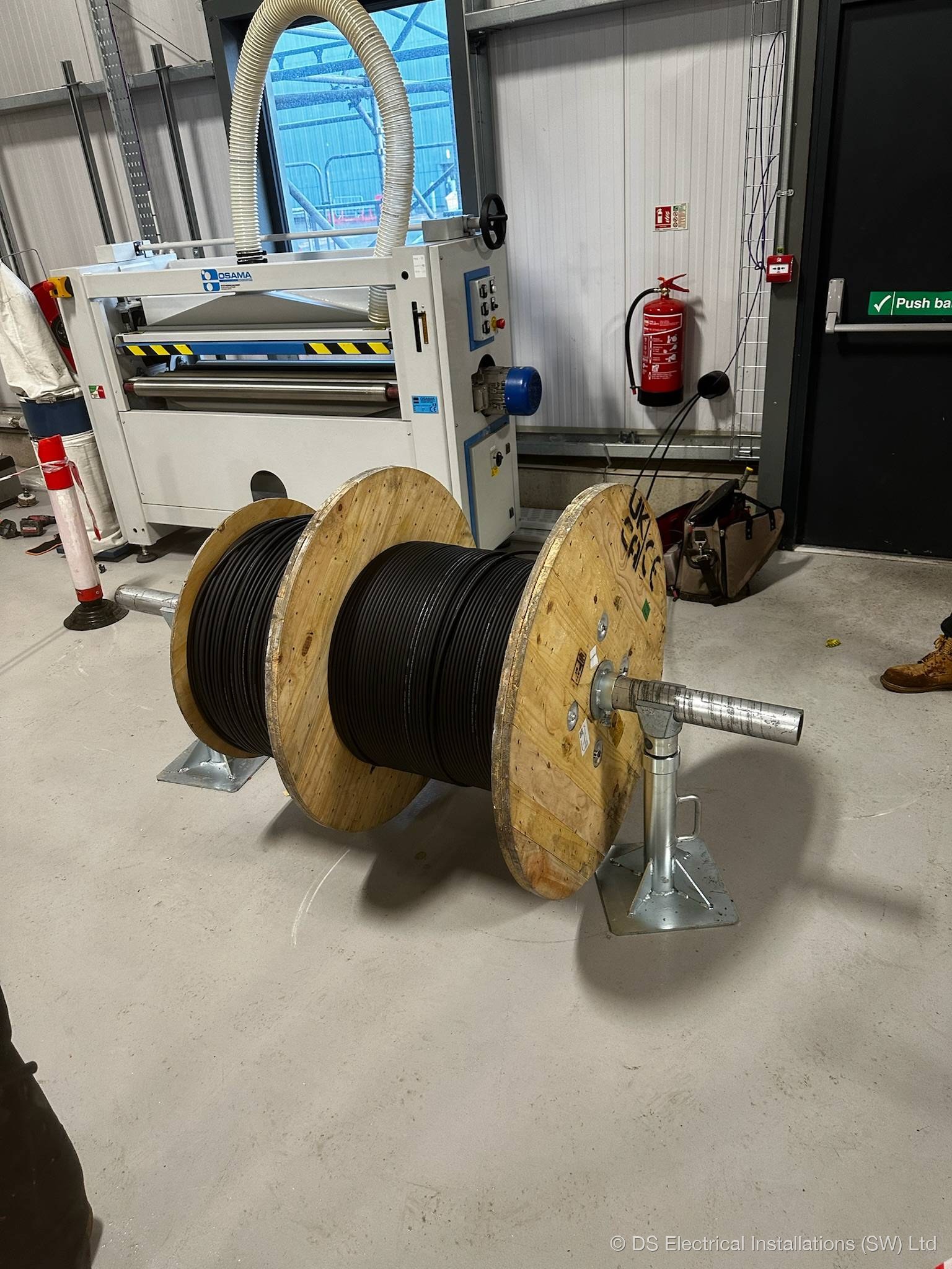 Cat6a data cable drum on roller jacks ready for structured cabling install by DS Electrical