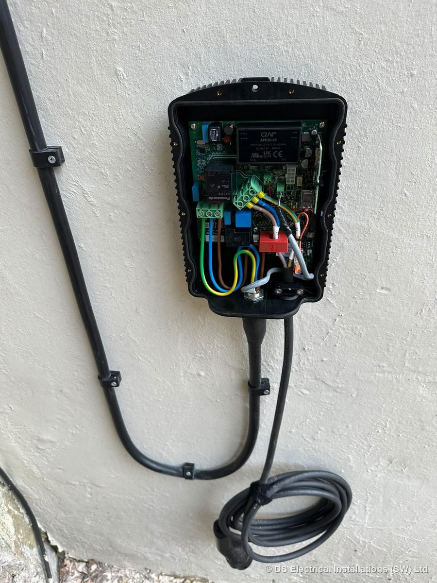EV charge point opened up with supply terminated and CT clamp fitted before commissioning