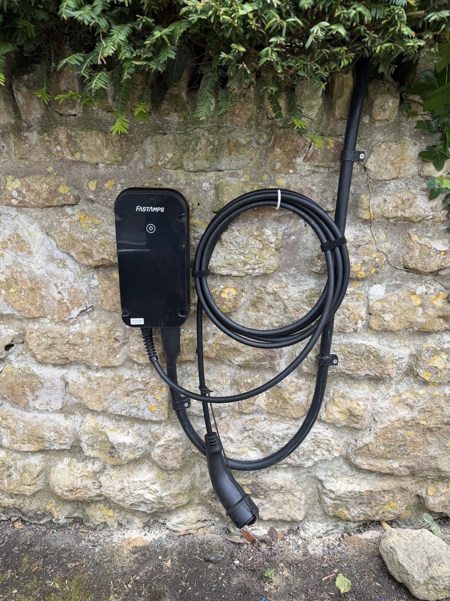 FastAmps EV charger installed on stone wall by DS Electrical