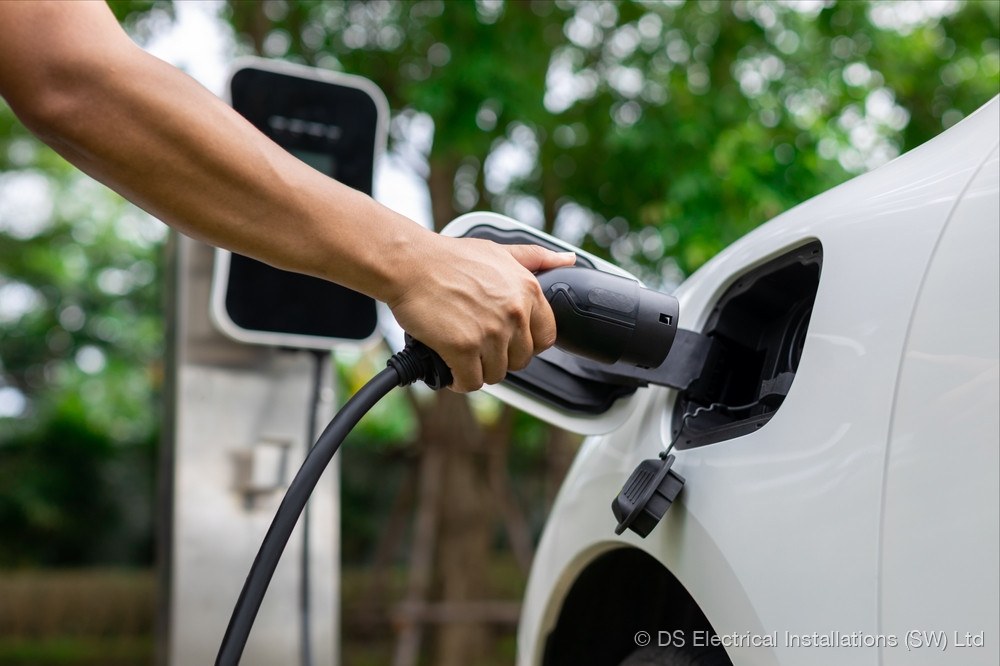Wall-mounted home EV charger fitted to render exterior with neat surface-mounted SWA cable