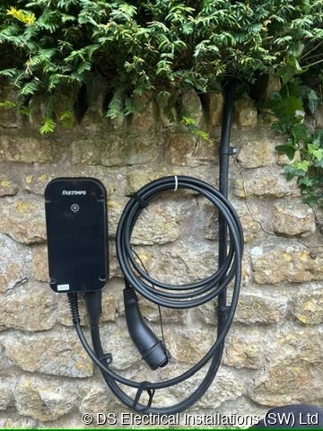 EV charger mounted on a stone wall