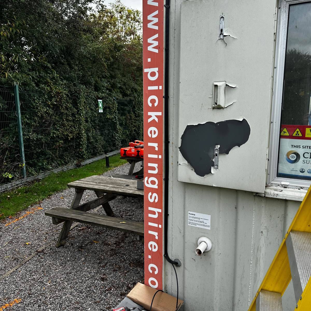 External cable containment and gland plate fixed to a steel structure during a commercial site installation