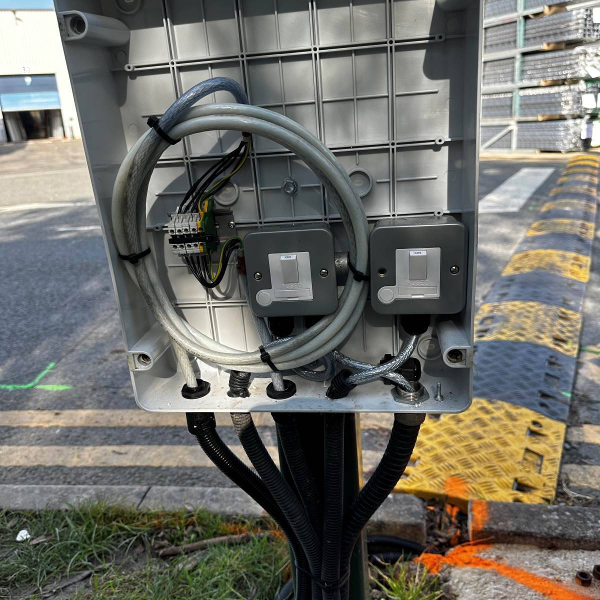Outdoor weatherproof enclosure with twin switched fused connection units and SWA cable supplying site equipment