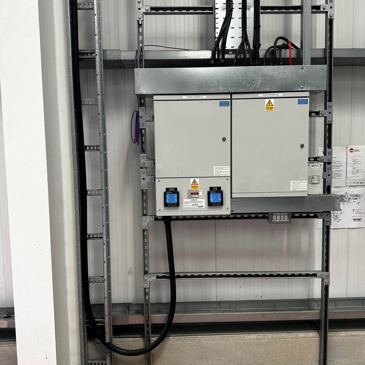 Commercial LED panel lighting with surface-mounted containment and cable tray installed by DS Electrical