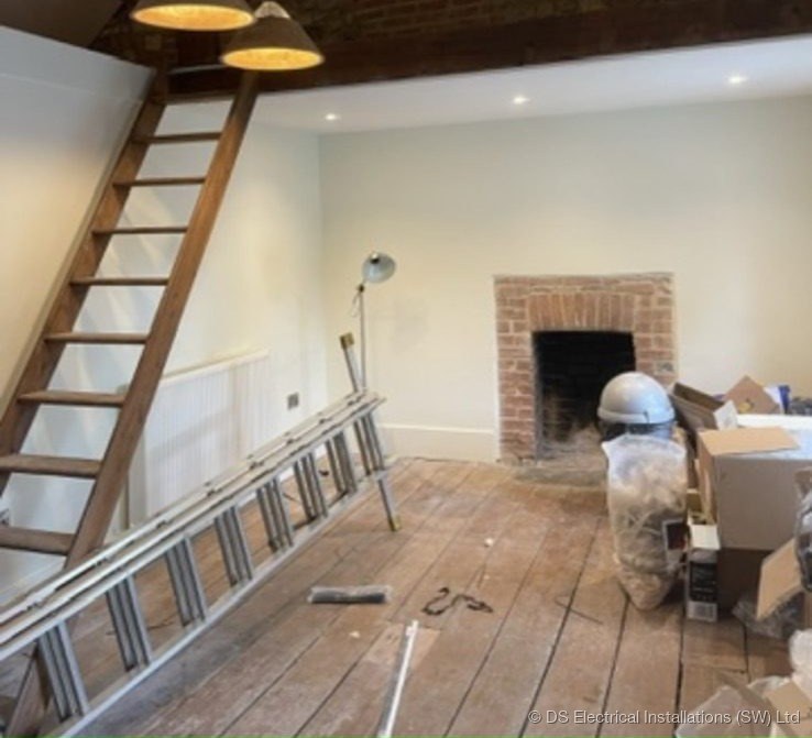Heritage room with exposed beams and double pendant lighting