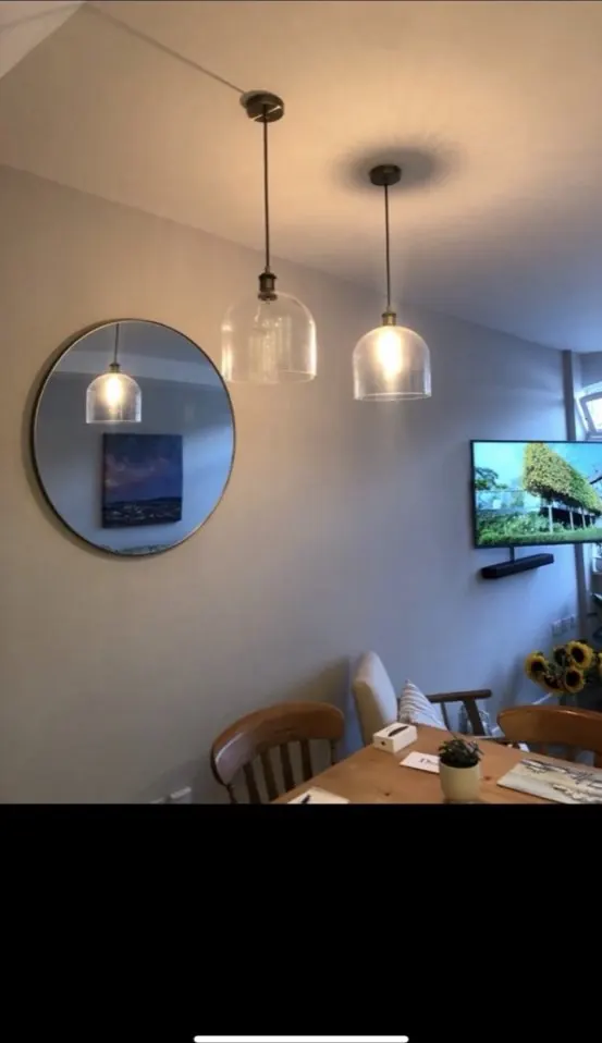 Designer glass pendant lighting in period dining room