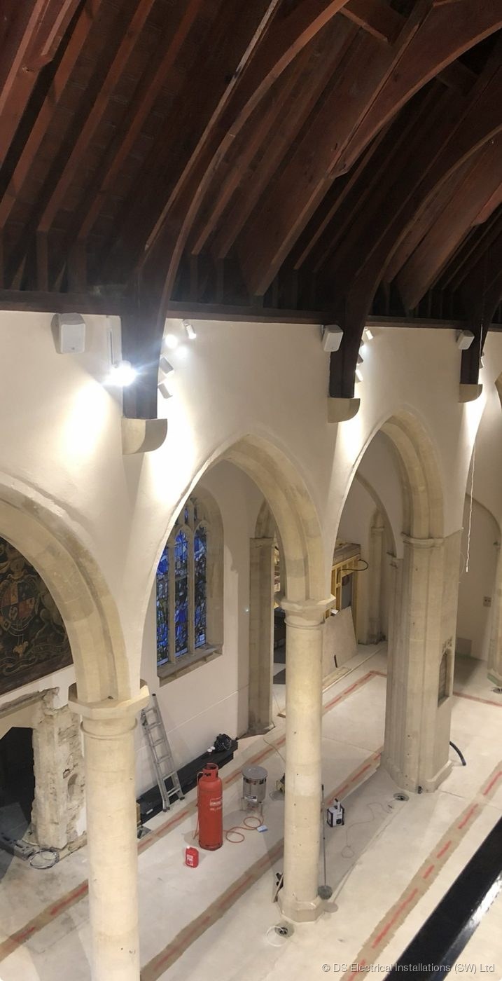 Heritage stone corridor with discreet recessed downlighting by DS Electrical