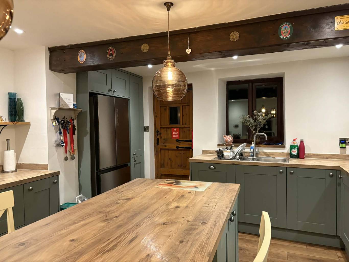 Full kitchen rewire — pendants, downlights, oak island, exposed beam