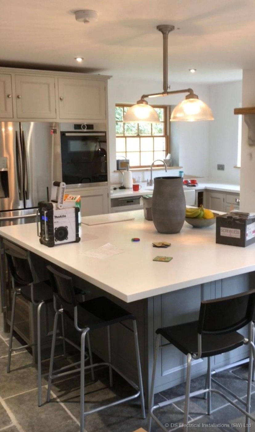 Kitchen with island, pendant and recessed downlighting by DS Electrical