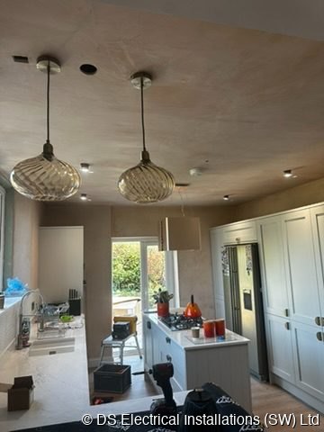Kitchen with amber pendant lighting