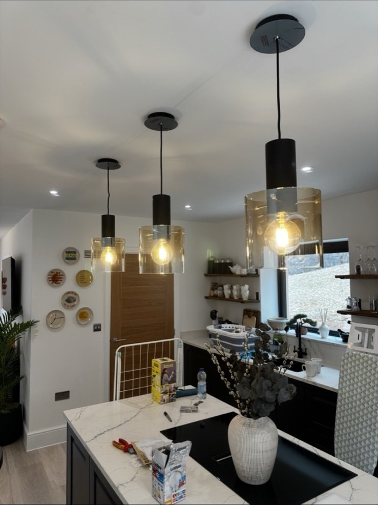 Modern kitchen with pendant lights by DS Electrical