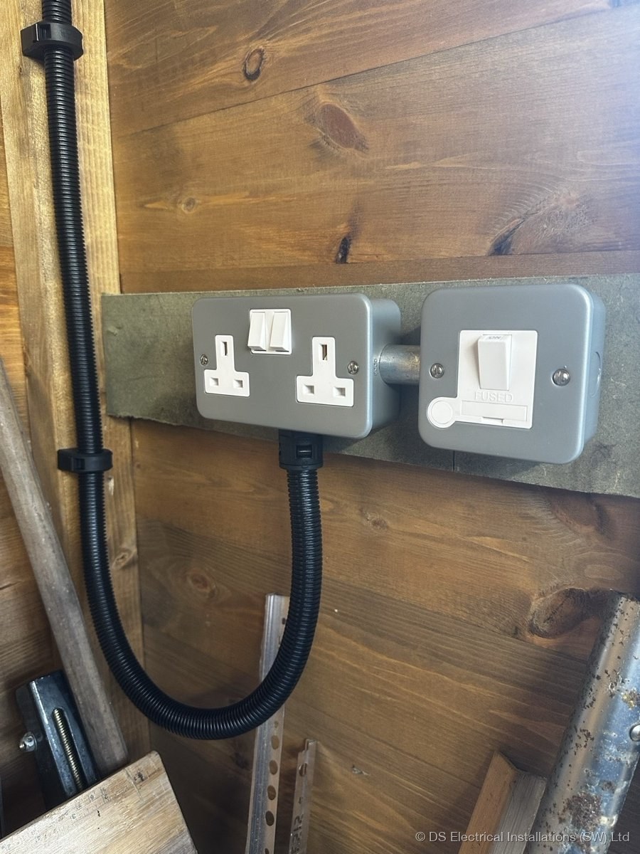 Outdoor rated socket and switch installation on timber outbuilding