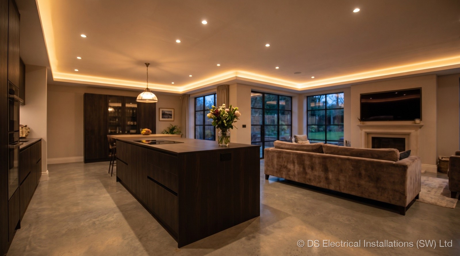 Open-plan kitchen with recessed downlights and LED cove lighting, installed by DS Electrical