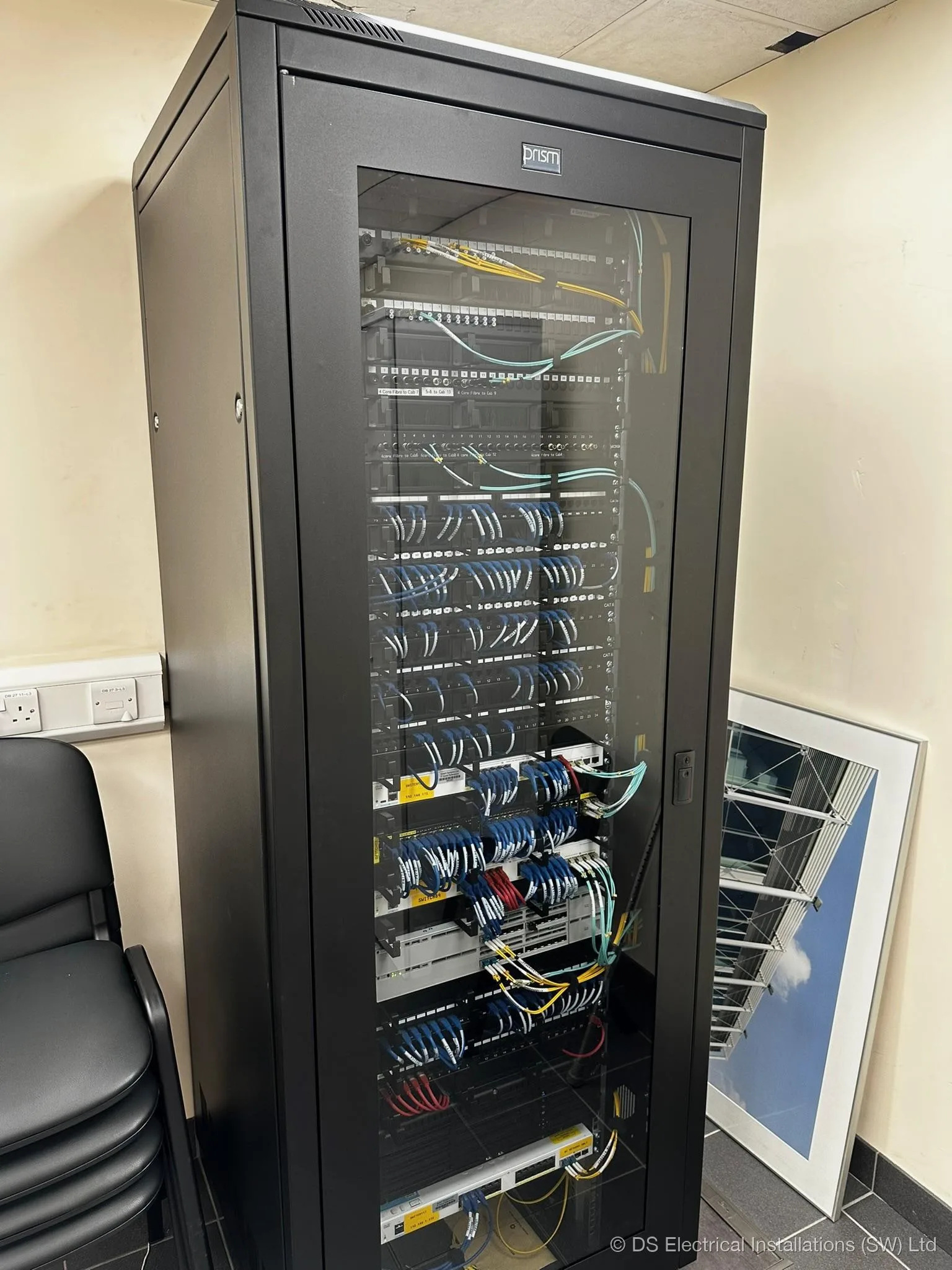 Dressed commercial comms cabinet with structured cabling