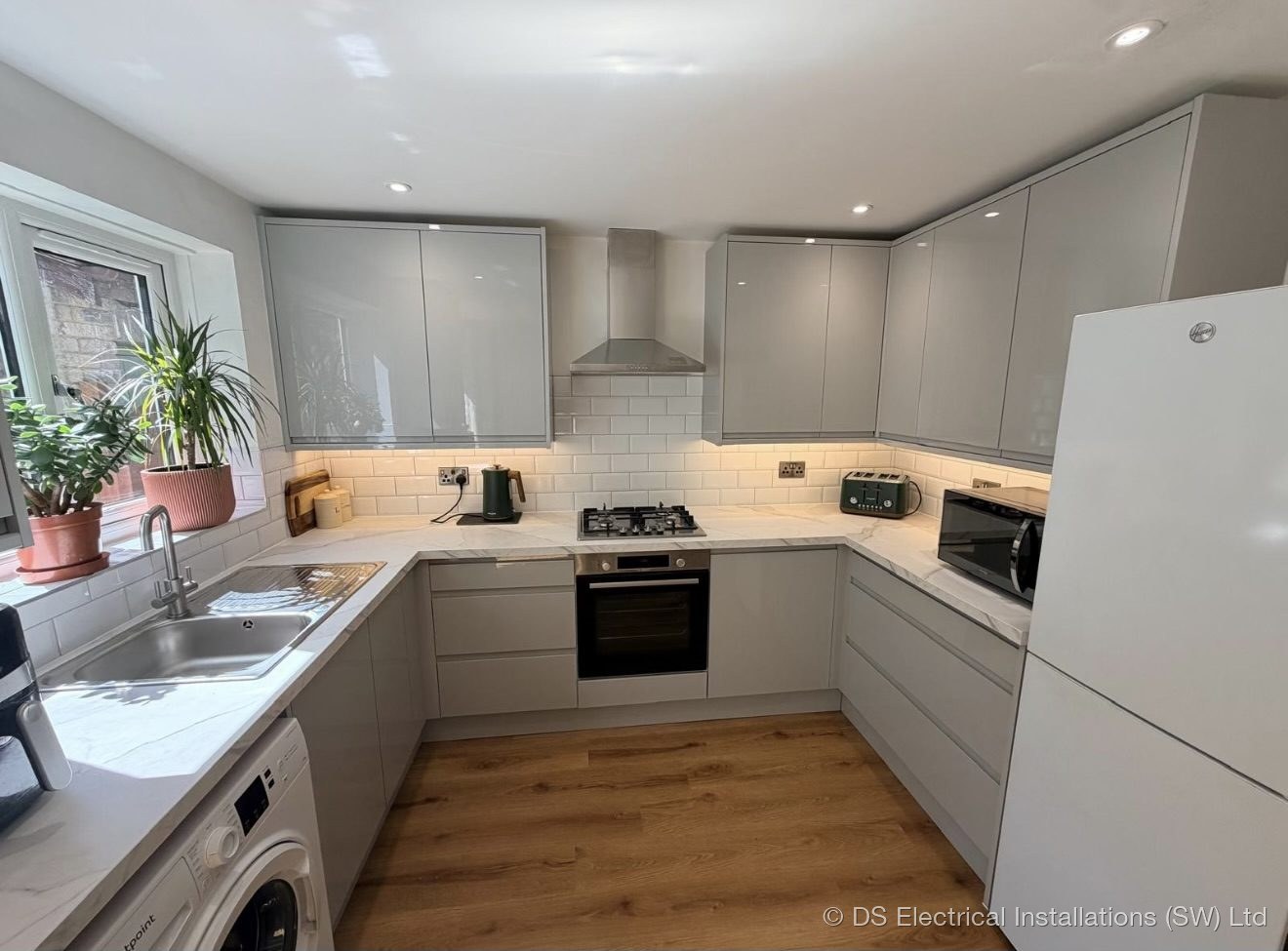 Completed kitchen in Shepton Mallet with LED downlights and under-cabinet lighting installed by DS Electrical