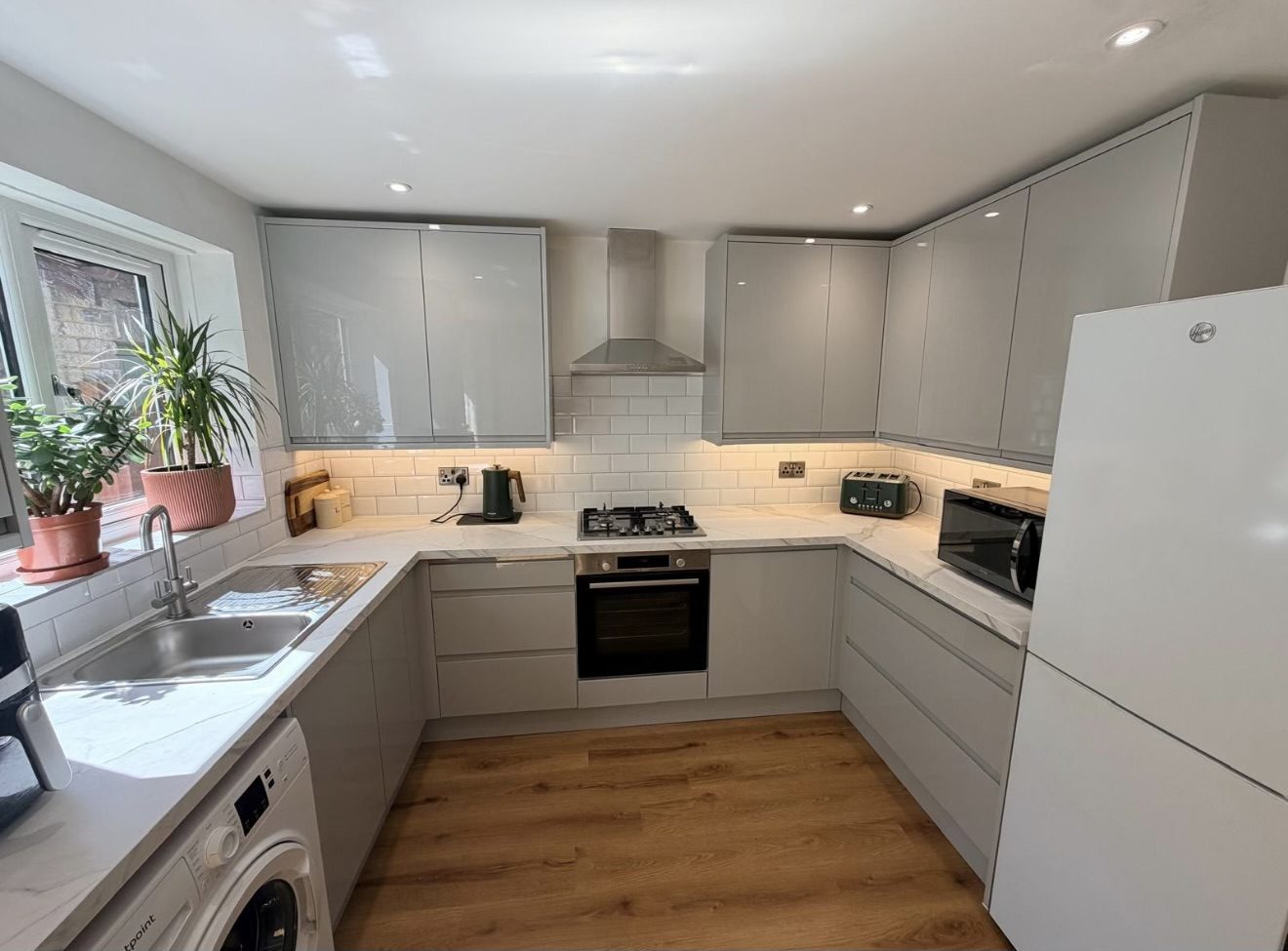 Completed kitchen in Shepton Mallet with LED downlights and under-cabinet lighting installed by DS Electrical