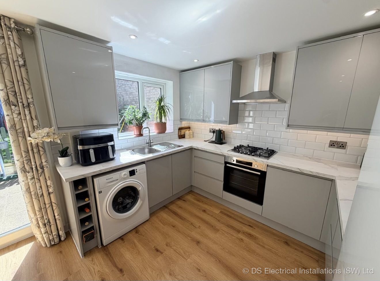 Under-cabinet LED lighting and appliance circuits over the worktop in a Shepton Mallet kitchen by DS Electrical