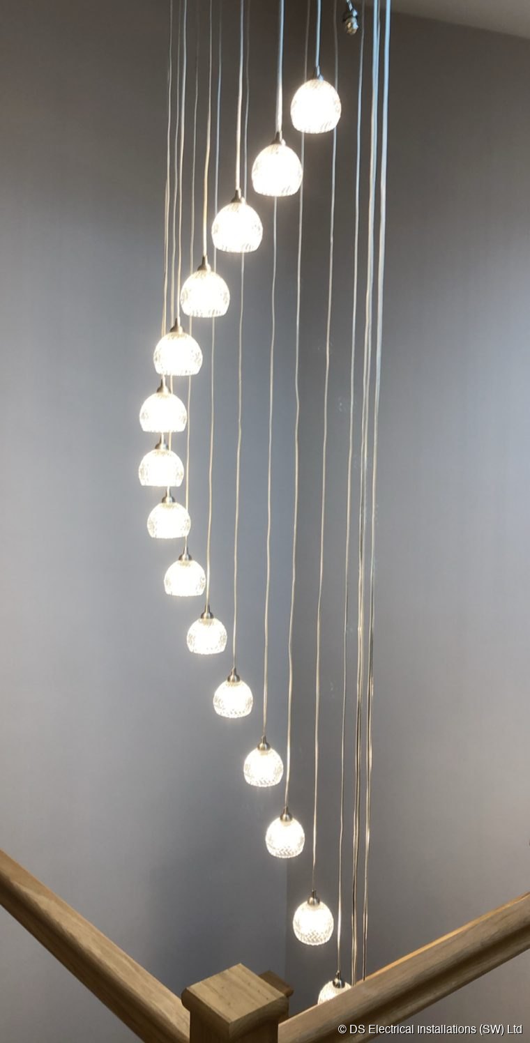 Chandelier down a period spiral staircase
