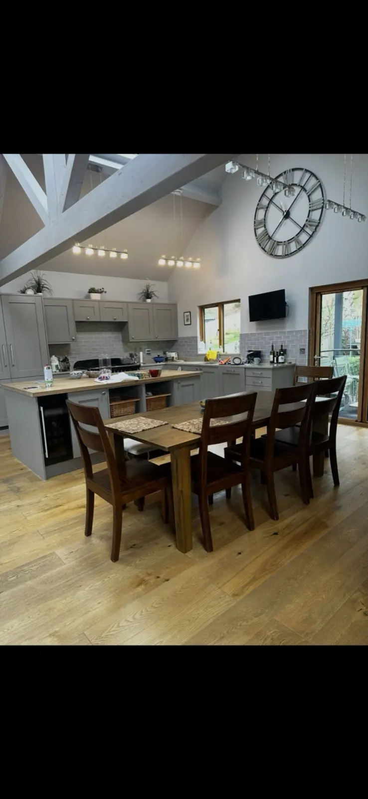Vaulted-ceiling kitchen lighting installation in a period barn conversion