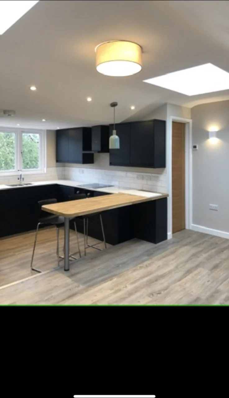 Lighting in a vaulted oak-beam ceiling